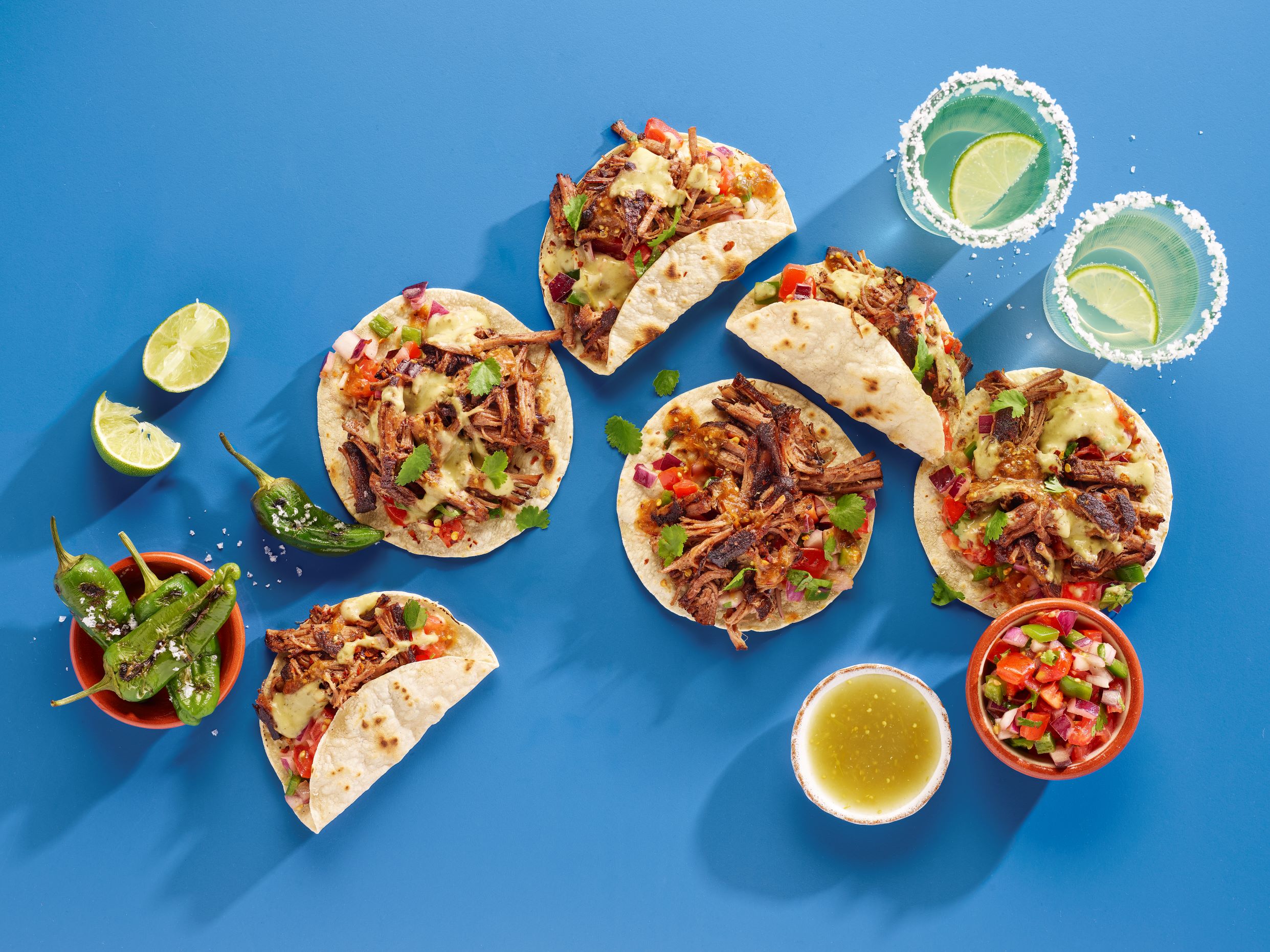 Cantina Carne Asada tacos with salsa and mojitos